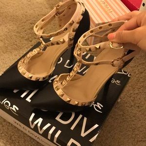 black and nude studded heels